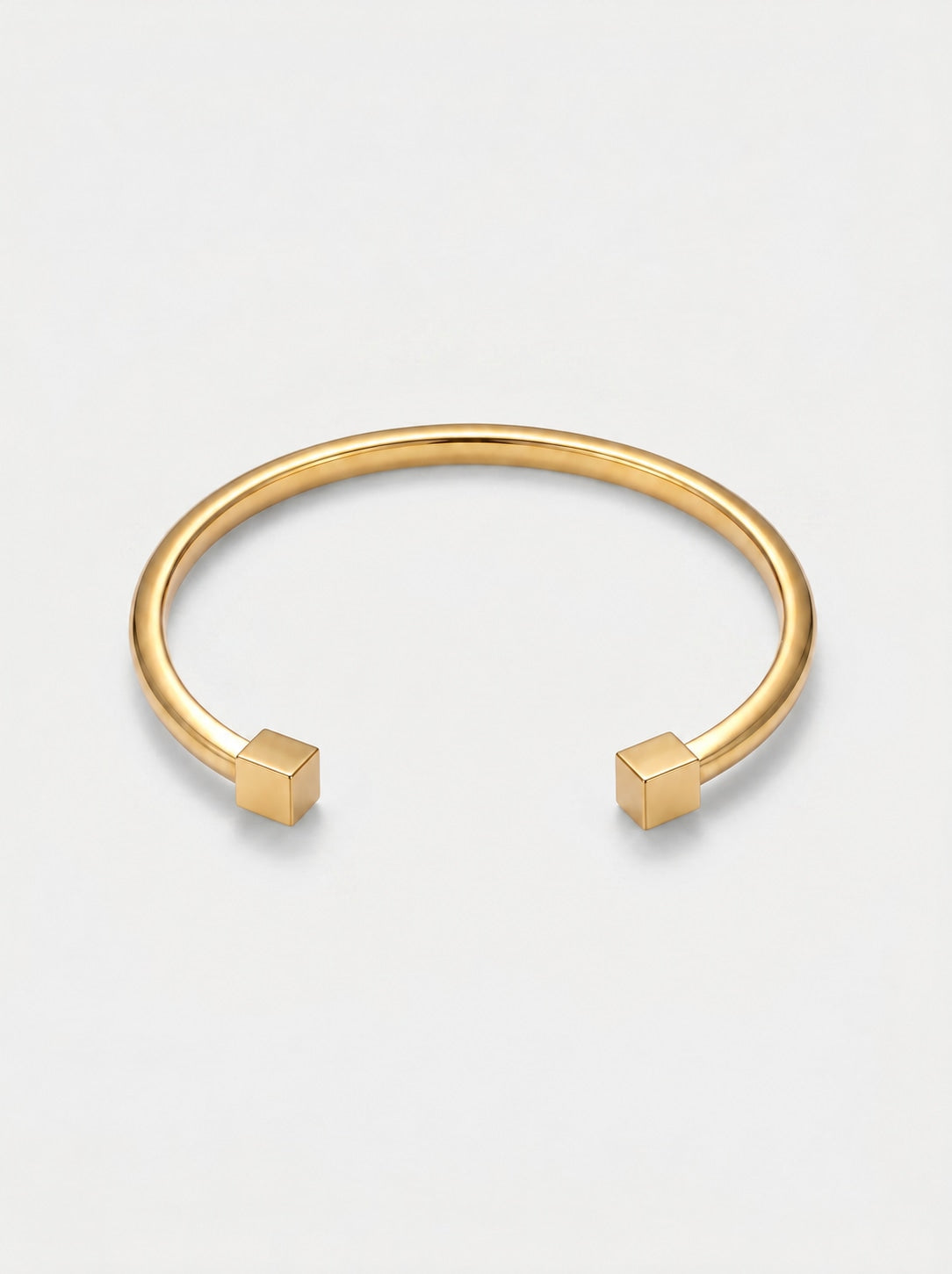 Pulseira Cuff Geométrica dourada — catálogo com terminações cúbicas