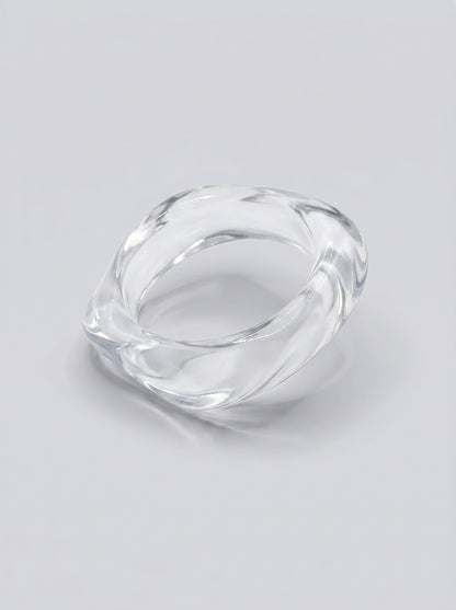 Pulseira Cristal em resina marmoreada transparente com reflexos cristalinos, com design orgânico geométrico e acabamento brilhante, ideal para um look elegante e contemporâneo.
