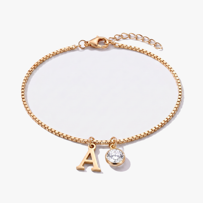 Pulseira letra A dourada com pedra de nascimento Abril — Diamante