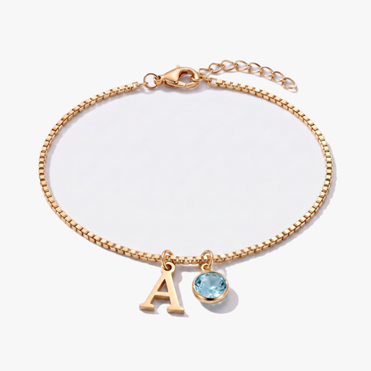 Pulseira letra A dourada com pedra de nascimento Março — Água-marinha