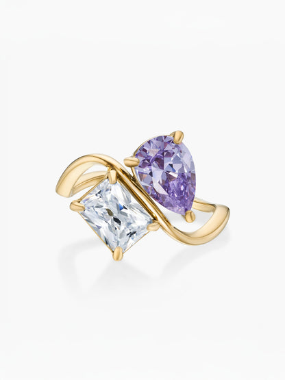 Anel duas pedras Fevereiro-Ametista (pera) e Abril-Diamante (retângulo) dourado