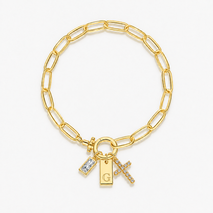 Pulseira dourada com inicial G e cruz