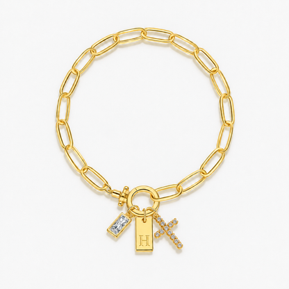 Pulseira dourada com inicial H e cruz