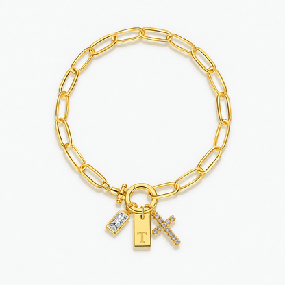 Pulseira dourada com inicial T e cruz