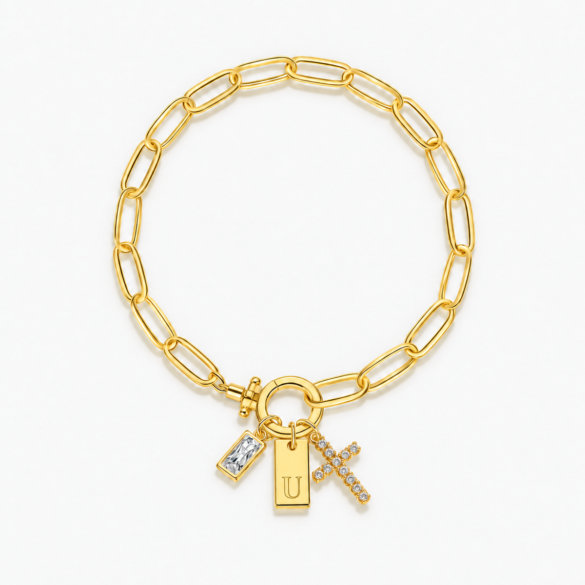 Pulseira dourada com inicial U e cruz