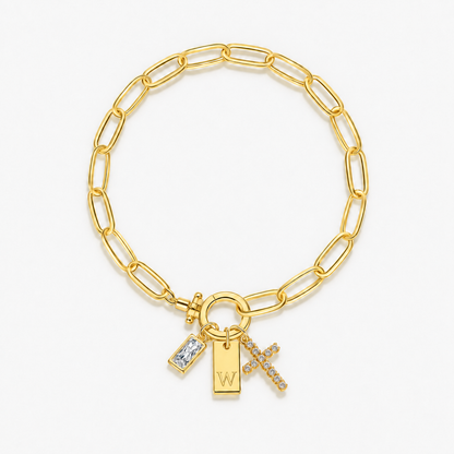 Pulseira dourada com inicial W e cruz