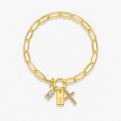Pulseira dourada com inicial X e cruz