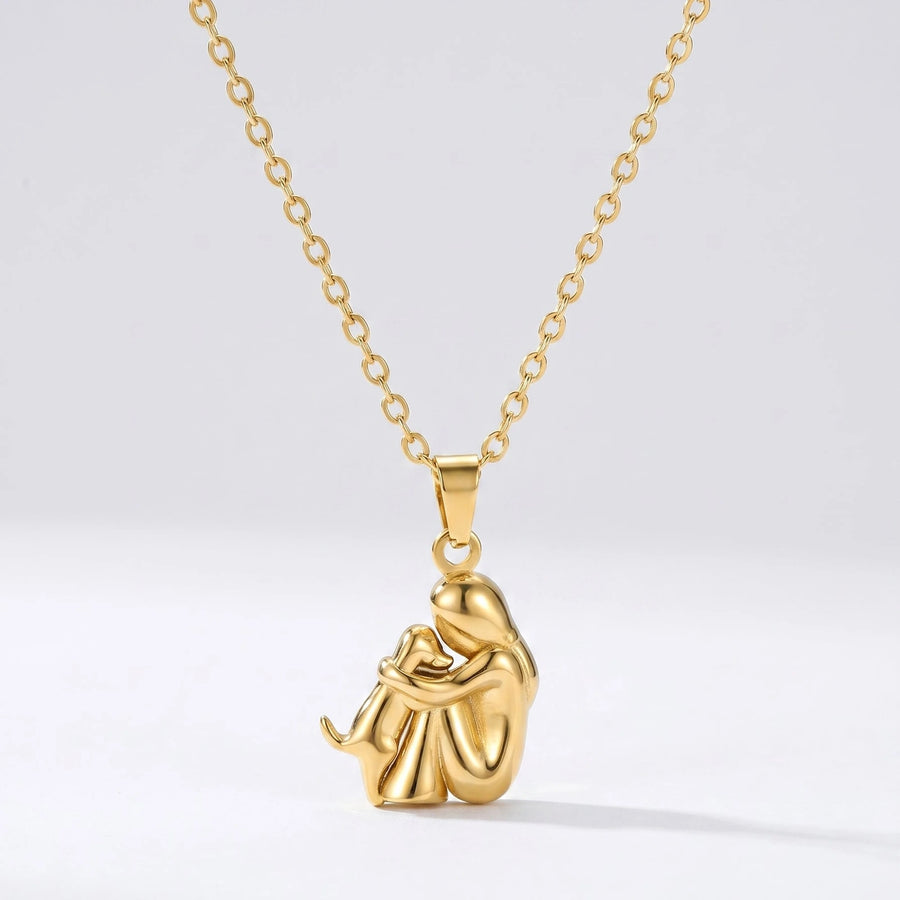 Colar Amor Fiel dourado com pendente de pessoa a abraçar um cão