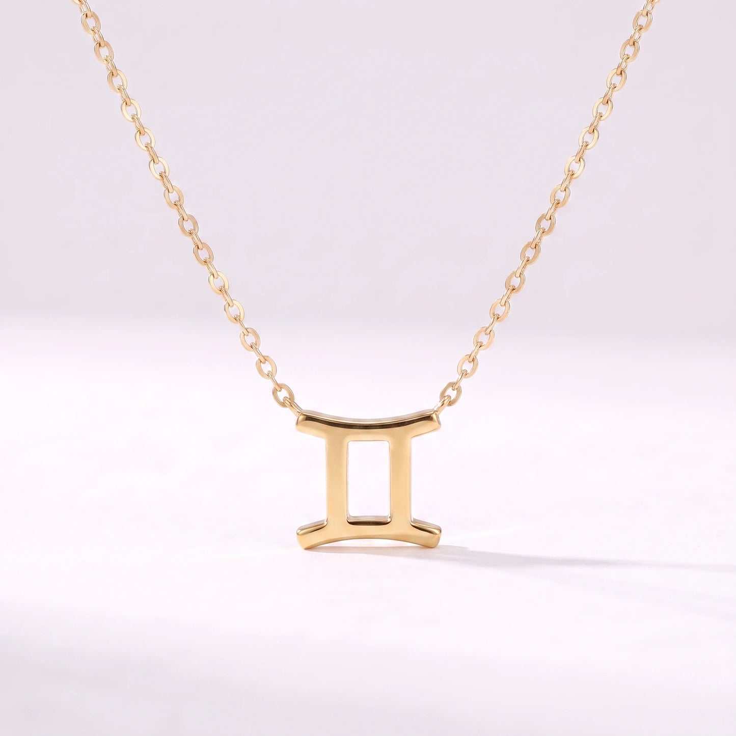 Colar símbolo do zodíaco Gémeos dourado