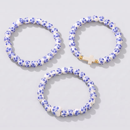 Conjunto de 3 Pulseiras Azulejo — as três pulseiras visíveis