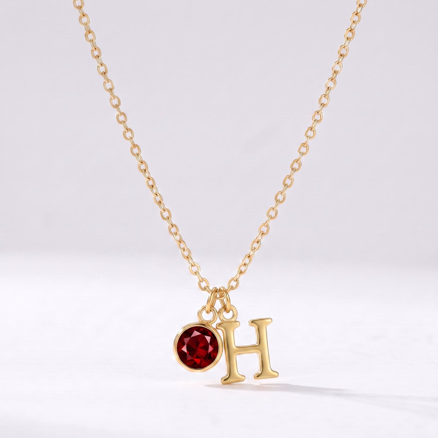 Colar letra H dourado com pedra de nascimento