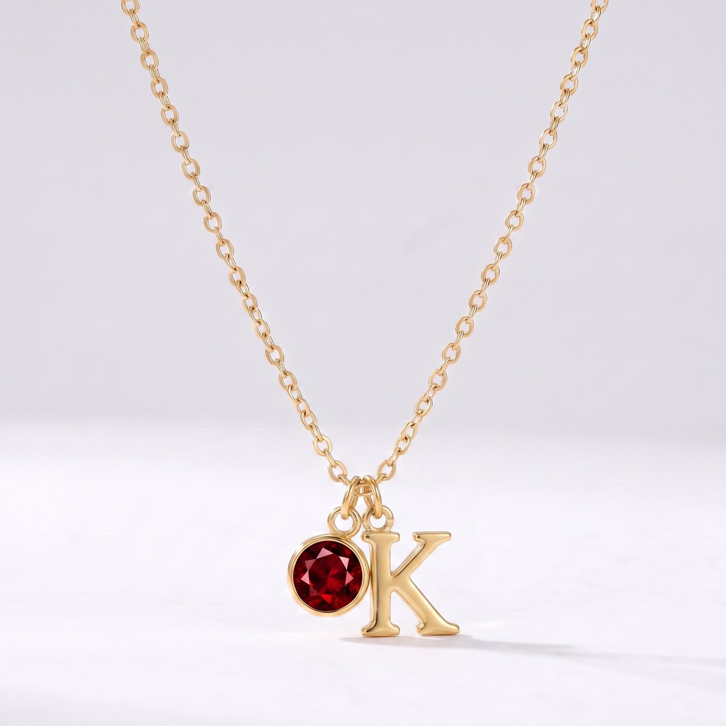 Colar letra K dourado com pedra de nascimento