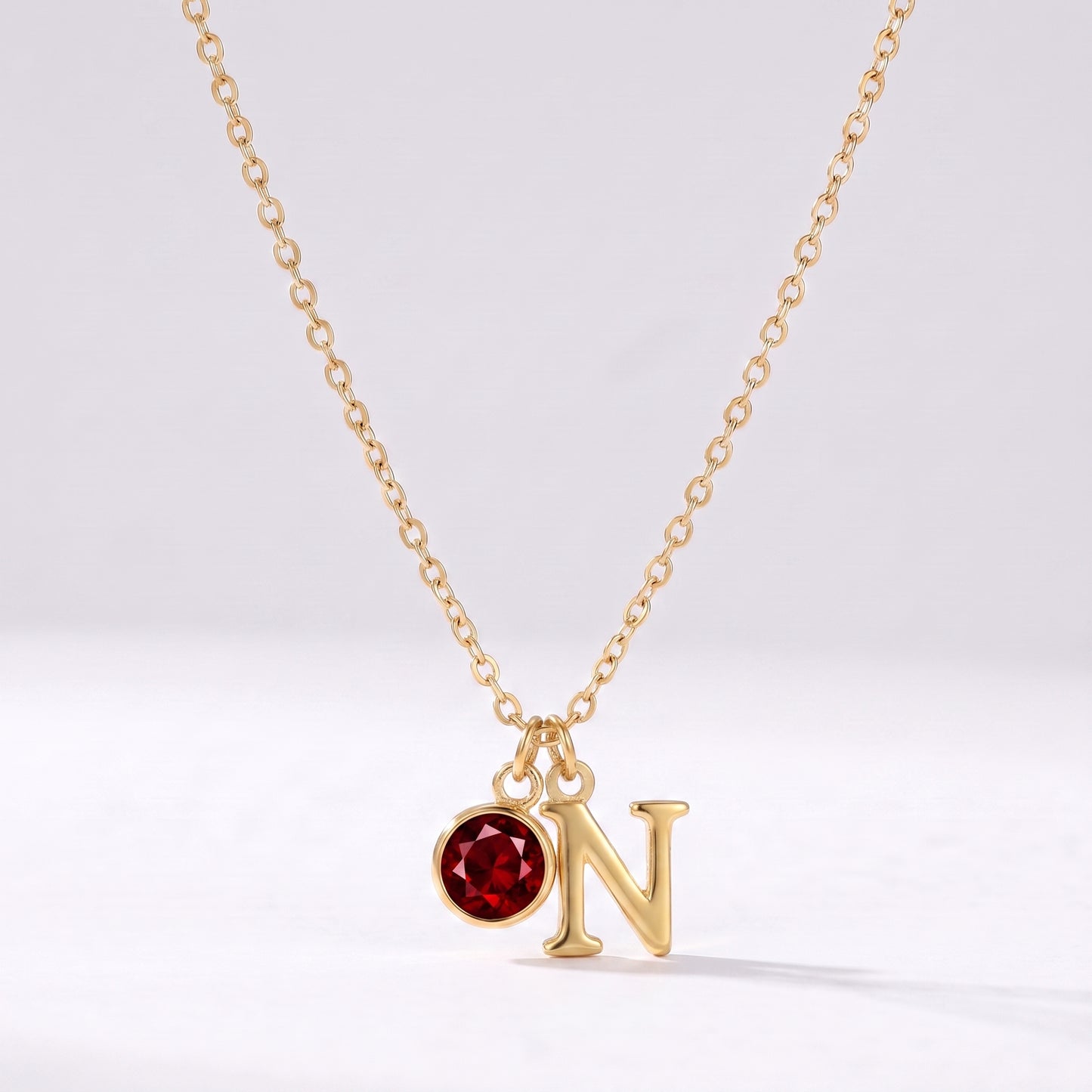 Colar letra N dourado com pedra de nascimento