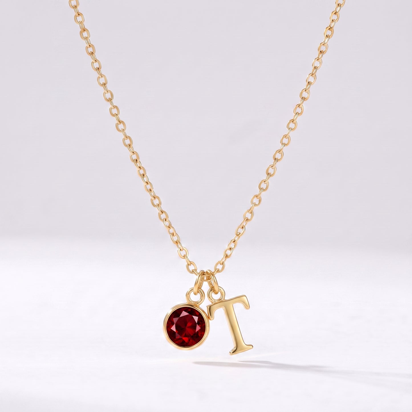 Colar letra T dourado com pedra de nascimento