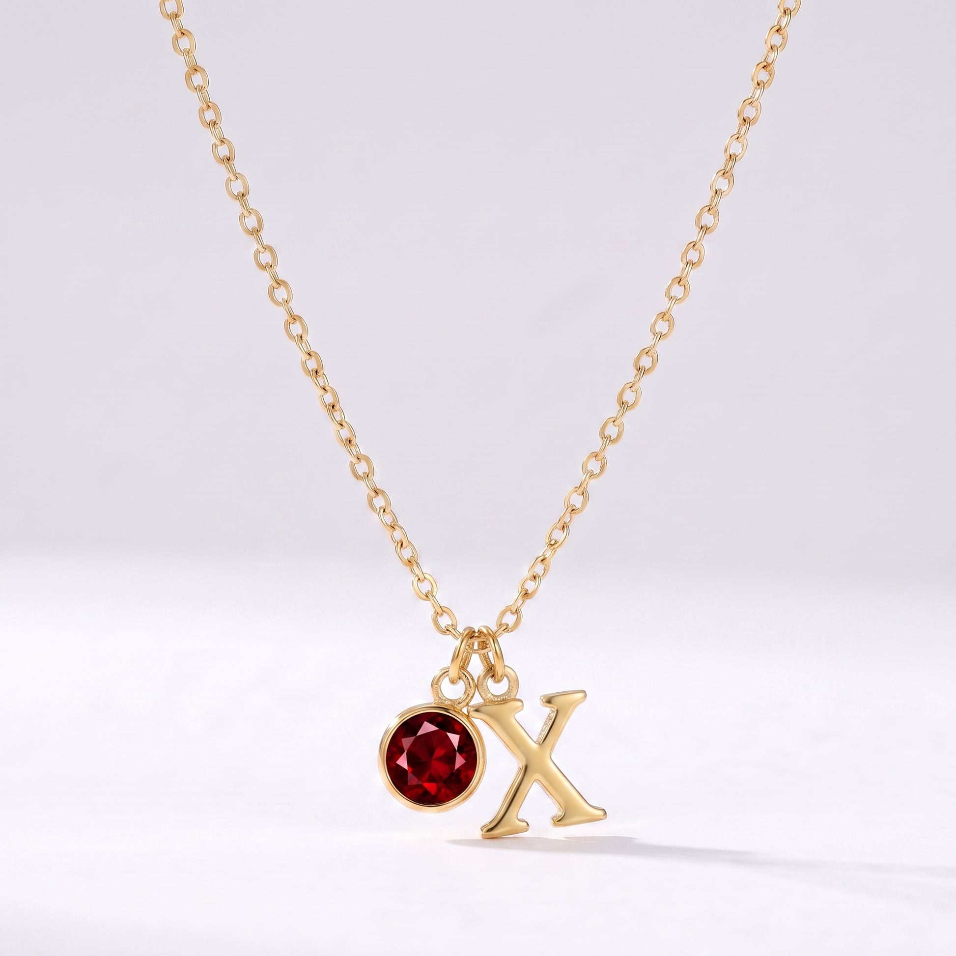 Colar letra X dourado com pedra de nascimento
