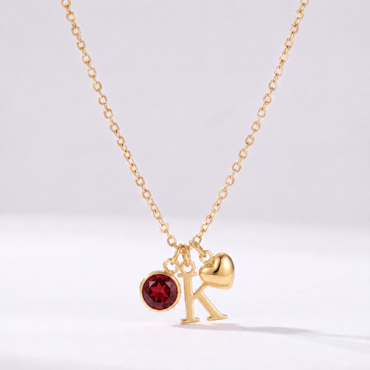 Colar letra K dourado com pedra de nascimento e coração