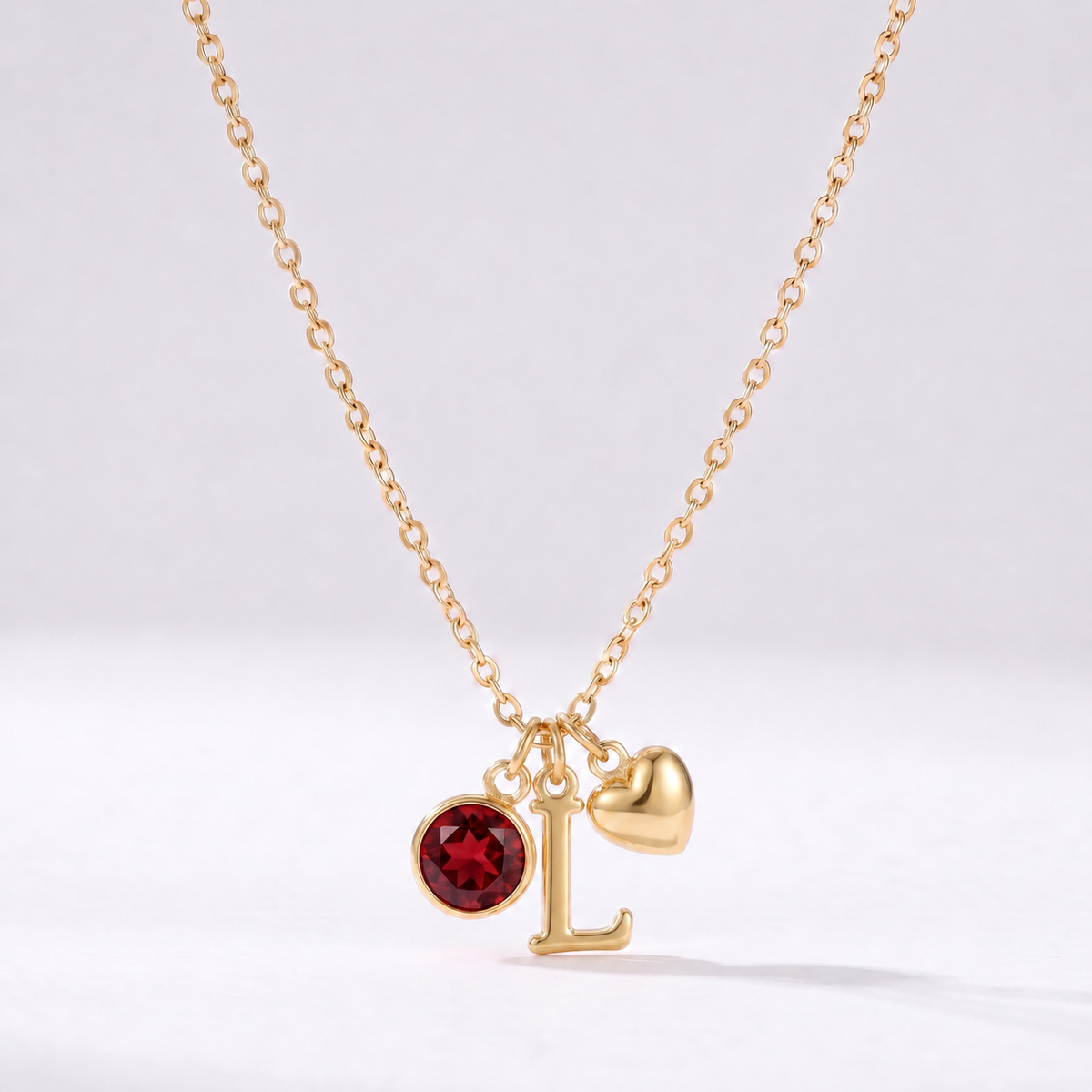 Colar letra L dourado com pedra de nascimento e coração