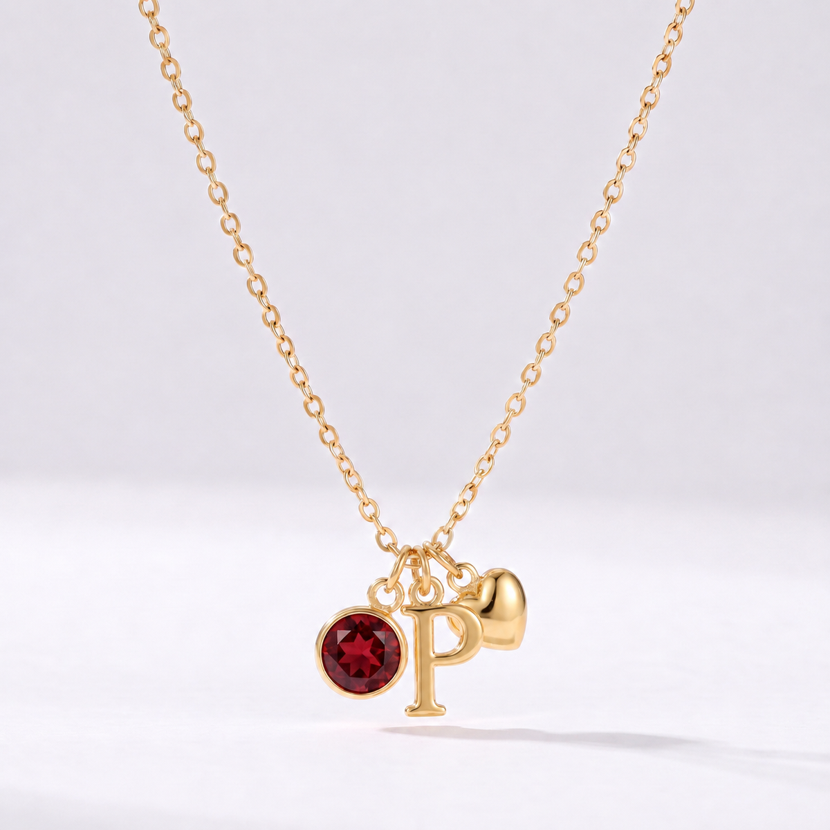 Colar letra P dourado com pedra de nascimento e coração