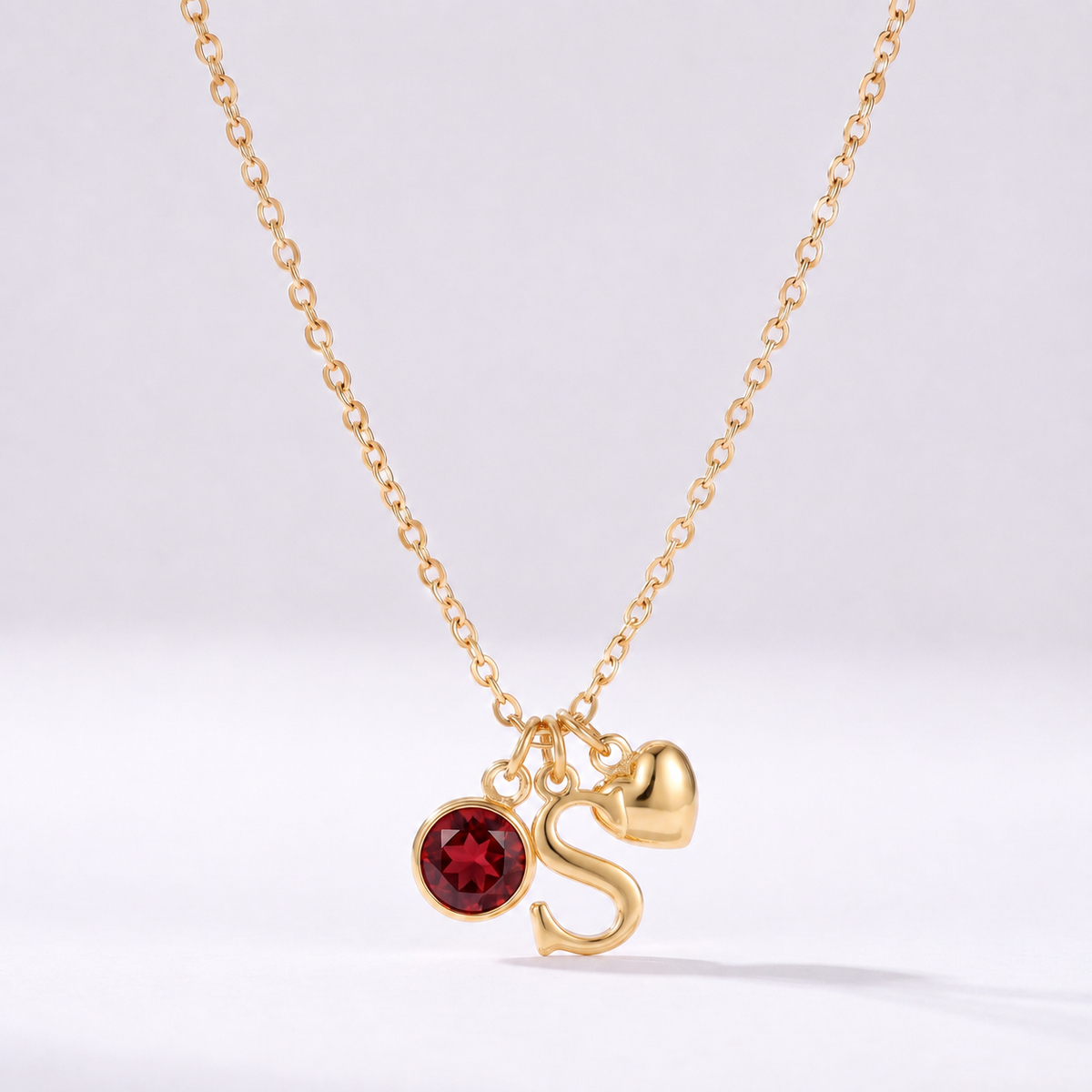Colar letra S dourado com pedra de nascimento e coração