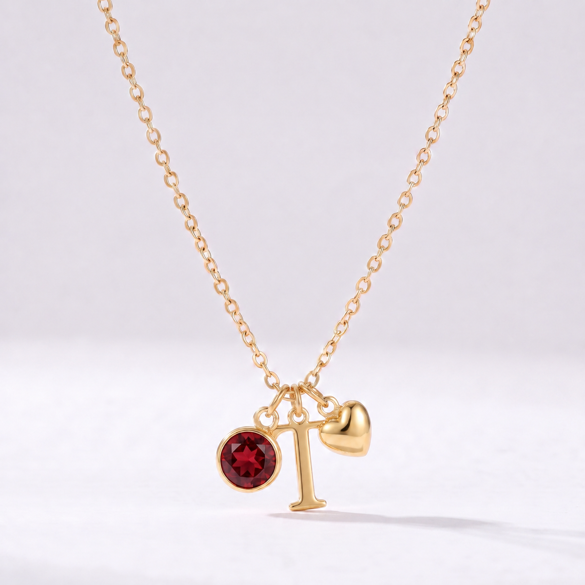 Colar letra T dourado com pedra de nascimento e coração