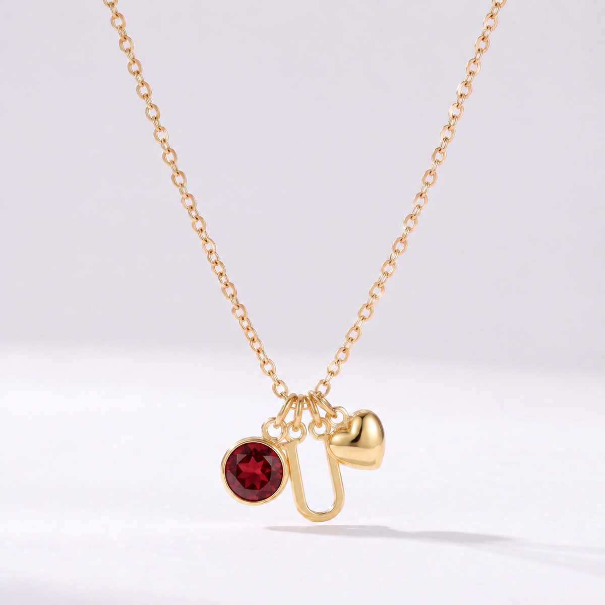 Colar letra U dourado com pedra de nascimento e coração