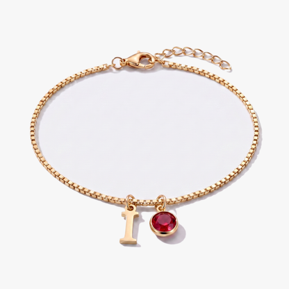 Pulseira letra I dourada com pedra de nascimento Janeiro — Granada