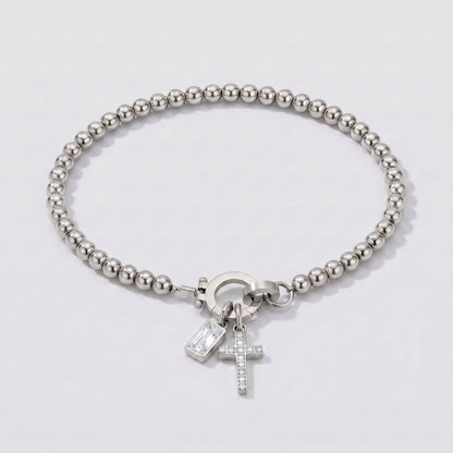 Pulseira prateada de contas com cruz e pedra de nascimento diamante transparente de abril.
